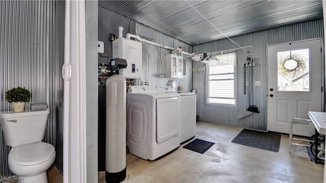 washroom with washing machine and clothes dryer