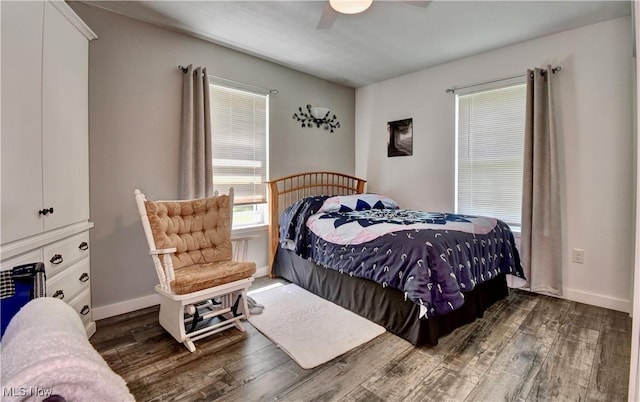 bedroom with wood finished floors, baseboards, and ceiling fan