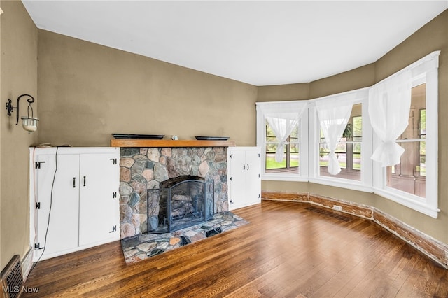 26561 Butternut Ridge Rd, North Olmsted, OH 44070 - unfurnished living room featuring hardwood / wood-style flooring and a fireplace