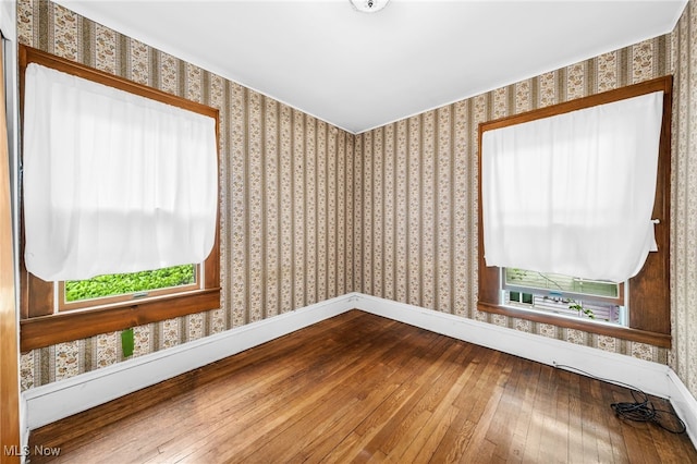 26561 Butternut Ridge Rd, North Olmsted, OH 44070 - unfurnished room with hardwood / wood-style floors, plenty of natural light, wallpapered walls, and baseboards