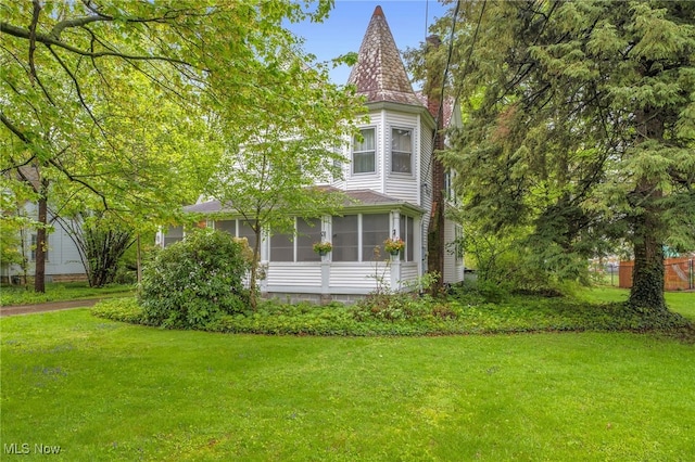 26561 Butternut Ridge Rd, North Olmsted, OH 44070 - view of property exterior featuring a lawn and a sunroom