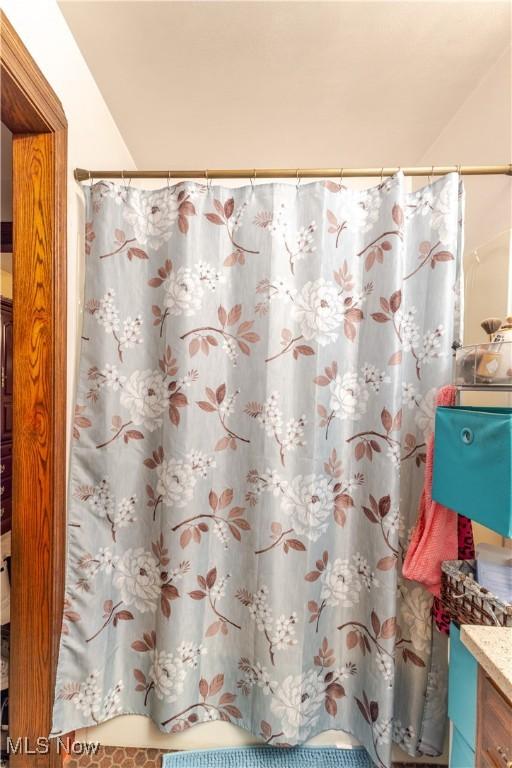 73 Hemlock Ln, Weirton, WV 26062 - full bathroom featuring vanity and a shower with shower curtain