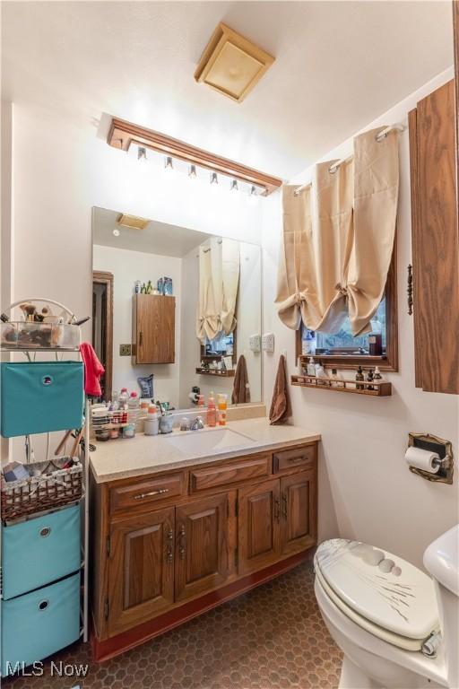 73 Hemlock Ln, Weirton, WV 26062 - bathroom featuring toilet and vanity