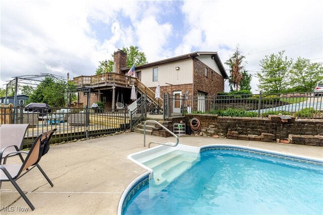 73 Hemlock Ln, Weirton, WV 26062 - view of swimming pool with stairway, a patio, and a deck
