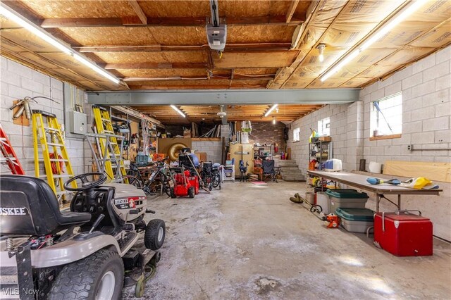 73 Hemlock Ln, Weirton, WV 26062 - garage featuring a workshop area and concrete block wall