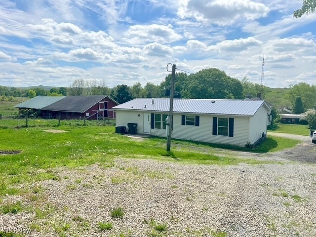 8248 Lappin Ln NE, Mineral City, OH 44656 - back of house with driveway and metal roof