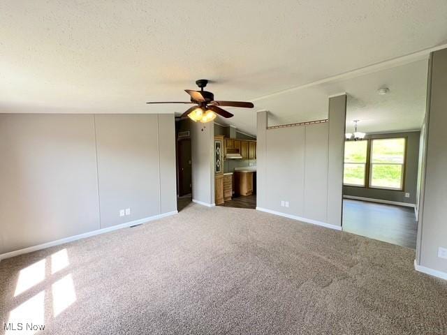 8248 Lappin Ln NE, Mineral City, OH 44656 - unfurnished living room featuring a ceiling fan, carpet flooring, baseboards, and a textured ceiling