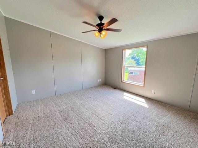 8248 Lappin Ln NE, Mineral City, OH 44656 - carpeted empty room featuring a ceiling fan