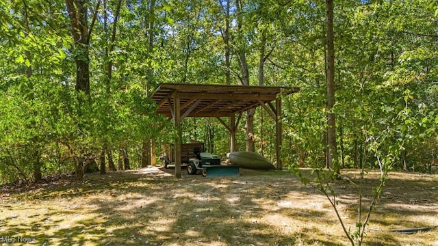 70 Northlake Ct, Vincent, OH 45784 - view of yard featuring a detached carport and a forest view