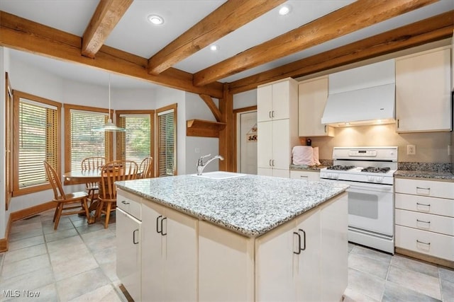 70 Northlake Ct, Vincent, OH 45784 - kitchen with white range with gas cooktop, a sink, beamed ceiling, pendant lighting, and premium range hood