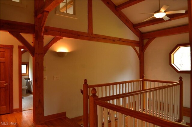 70 Northlake Ct, Vincent, OH 45784 - hallway with beam ceiling, wood finished floors, and an upstairs landing