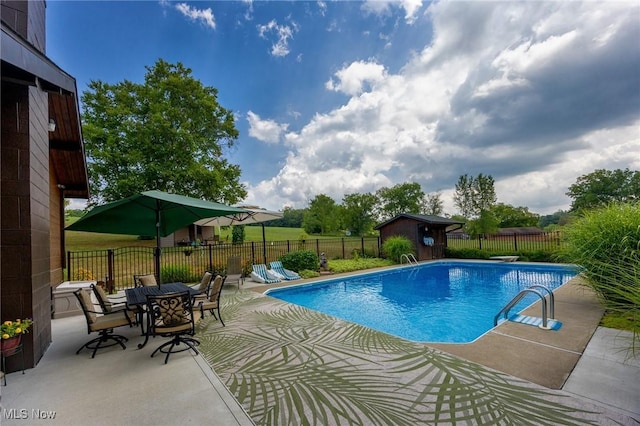 55901 Deep Run Rd, Martins Ferry, OH 43935 - view of pool with a patio, a fenced backyard, an outdoor structure, a storage unit, and outdoor dining space