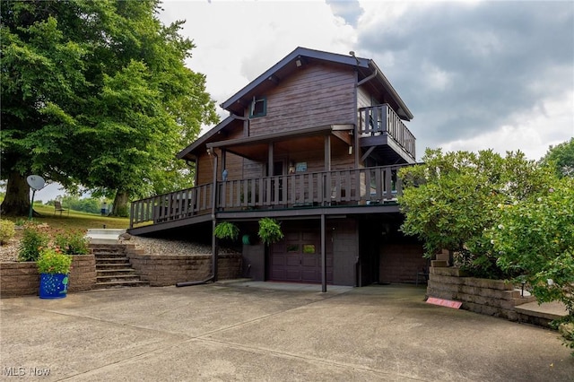 55901 Deep Run Rd, Martins Ferry, OH 43935 - back of property with a garage, stairs, and driveway