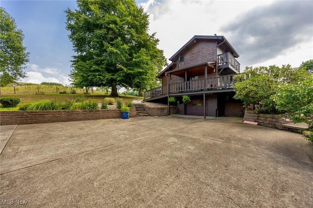 55901 Deep Run Rd, Martins Ferry, OH 43935 - view of side of home with a garage, driveway, a wooden deck, and stairway