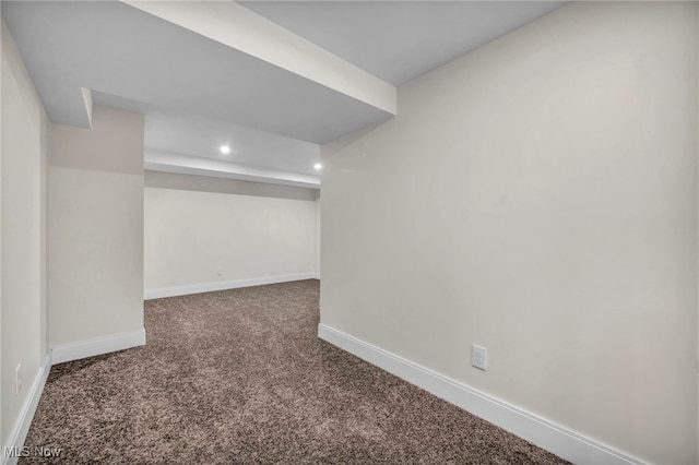 finished below grade area with carpet flooring, recessed lighting, and baseboards