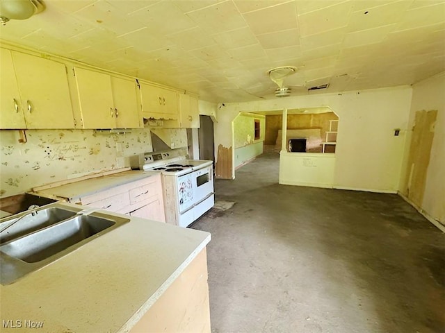 4308 Flat Rd SE, Uhrichsville, OH 44683 - kitchen with white electric range oven, unfinished concrete flooring, a sink, and light countertops