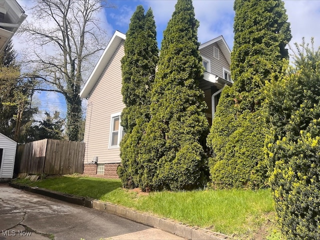 view of property exterior with fence