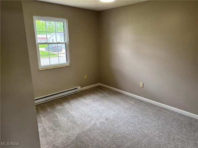 402 Washington Dr, Mineral Wells, WV 26150 - spare room with a baseboard radiator, carpet, and baseboards