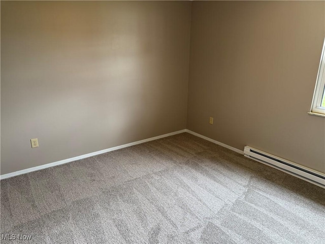 402 Washington Dr, Mineral Wells, WV 26150 - carpeted empty room featuring a baseboard radiator and baseboards