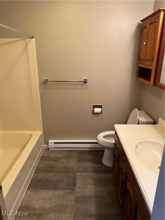 402 Washington Dr, Mineral Wells, WV 26150 - full bathroom featuring a baseboard heating unit, toilet, baseboards, and vanity