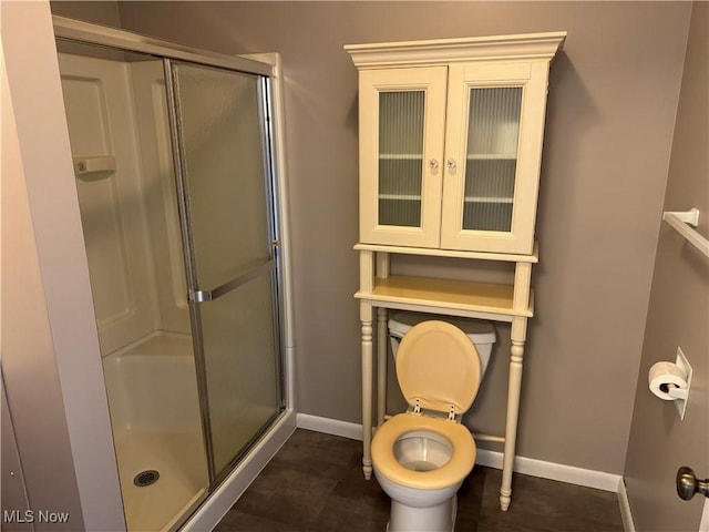 402 Washington Dr, Mineral Wells, WV 26150 - full bathroom with baseboards, a shower stall, and toilet