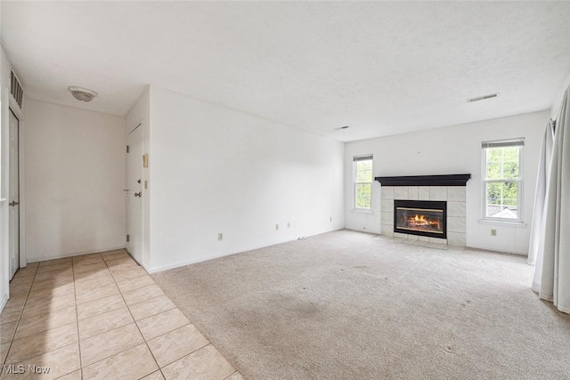 1328 Cedarwood Dr Unit A3, Westlake, OH 44145 - unfurnished living room featuring a fireplace, tile patterned floors, and carpet floors