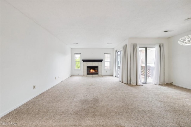 1328 Cedarwood Dr Unit A3, Westlake, OH 44145 - unfurnished living room with a tile fireplace, carpet floors, and baseboards