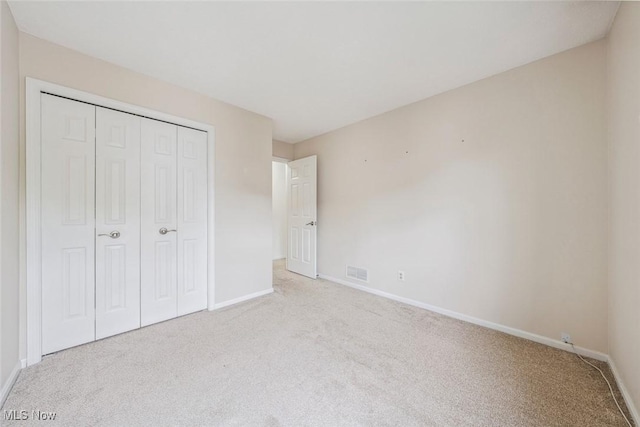 1328 Cedarwood Dr Unit A3, Westlake, OH 44145 - unfurnished bedroom with carpet, baseboards, and a closet