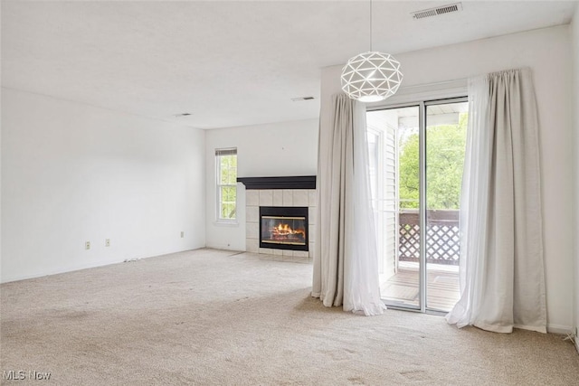 1328 Cedarwood Dr Unit A3, Westlake, OH 44145 - unfurnished living room with carpet flooring and a tiled fireplace
