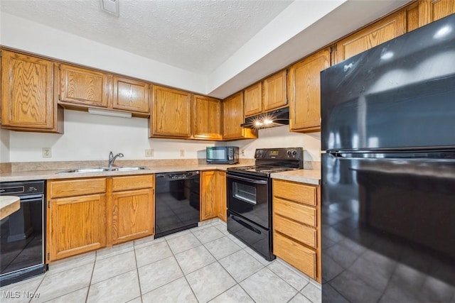 1328 Cedarwood Dr Unit A3, Westlake, OH 44145 - kitchen with black appliances, a sink, light countertops, a textured ceiling, and brown cabinets