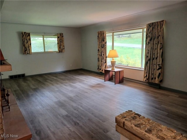 1050 Park Cir, Girard, OH 44420 - unfurnished room with a baseboard radiator, wood finished floors, and baseboards