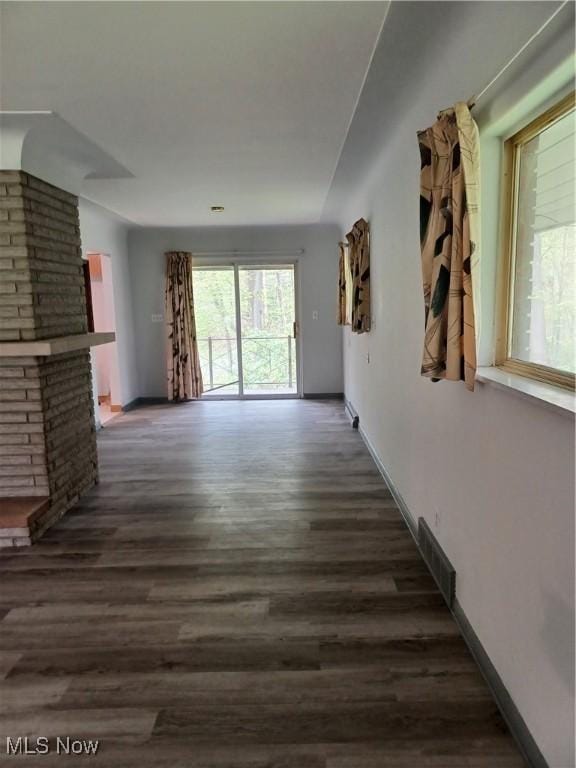 1050 Park Cir, Girard, OH 44420 - unfurnished living room with dark wood-style floors and baseboards