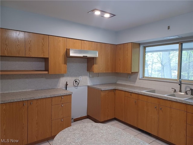1050 Park Cir, Girard, OH 44420 - kitchen featuring a sink, decorative backsplash, light tile patterned floors, and light countertops