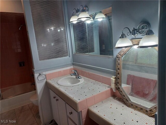 1050 Park Cir, Girard, OH 44420 - bathroom featuring toilet, enclosed tub / shower combo, vanity, and tile patterned flooring