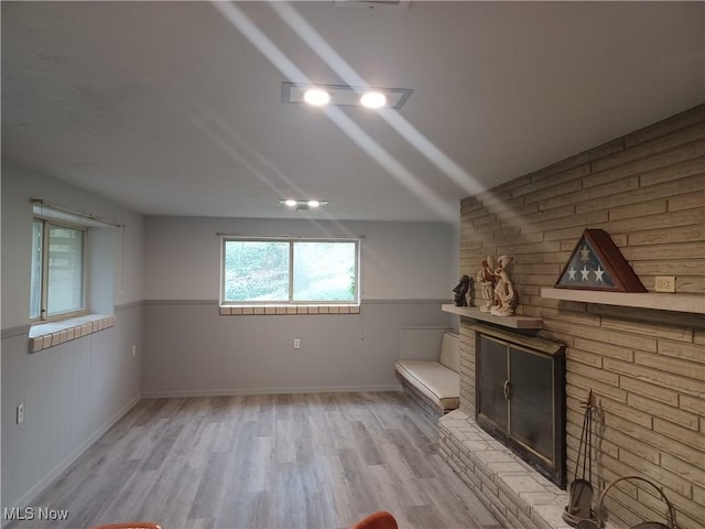 1050 Park Cir, Girard, OH 44420 - bonus room with a wainscoted wall, wood finished floors, a brick fireplace, and baseboards