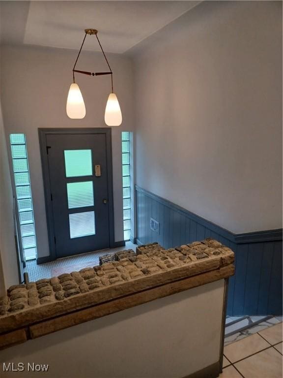 1050 Park Cir, Girard, OH 44420 - entryway featuring light tile patterned floors, wainscoting, and plenty of natural light