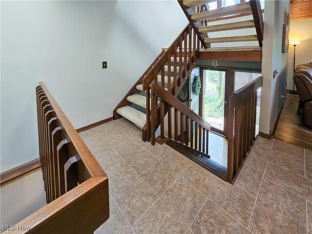 stairs featuring baseboards