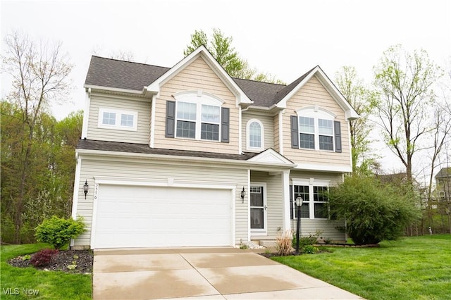 3576 Jude Cir, Reminderville, OH 44087 - traditional-style house featuring a garage, driveway, and a front lawn