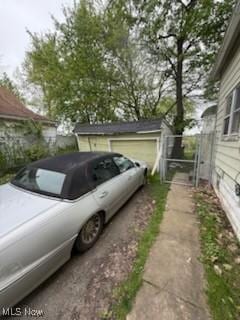 view of side of home featuring driveway