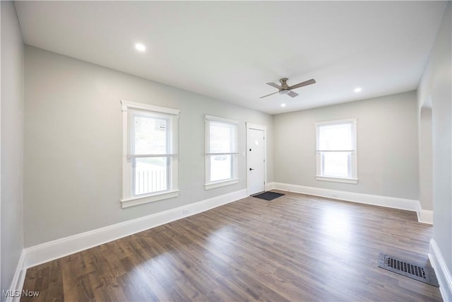 spare room featuring a ceiling fan, baseboards, wood finished floors, and recessed lighting