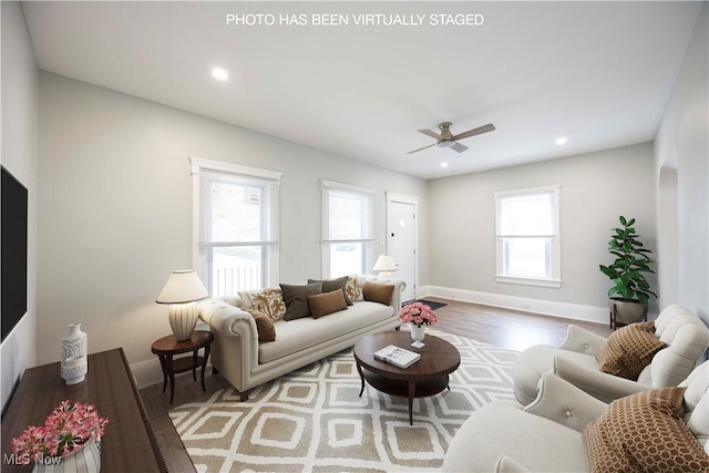 living room featuring wood finished floors, baseboards, a ceiling fan, and recessed lighting