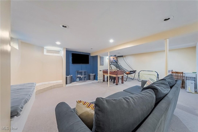 carpeted living area with recessed lighting