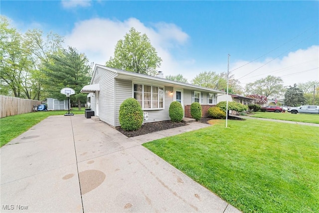 single story home featuring concrete driveway