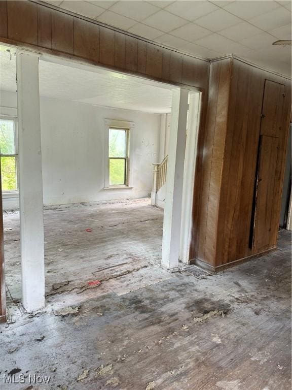 spare room featuring wooden walls