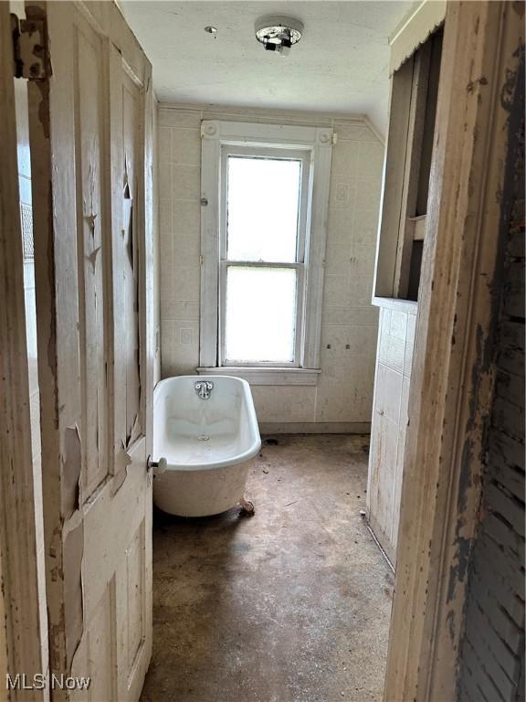 bathroom with a freestanding bath