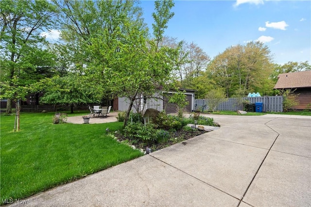 5550 Barton Rd, North Olmsted, OH 44070 - view of yard featuring driveway and a patio area