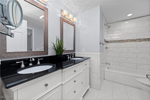 5550 Barton Rd, North Olmsted, OH 44070 - full bath featuring shower / bath combination, double vanity, toilet, tile patterned floors, and recessed lighting