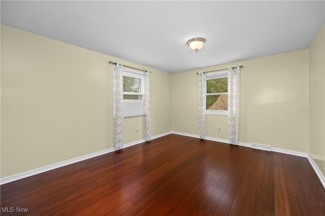 5550 Barton Rd, North Olmsted, OH 44070 - unfurnished room featuring healthy amount of natural light, baseboards, and hardwood / wood-style floors