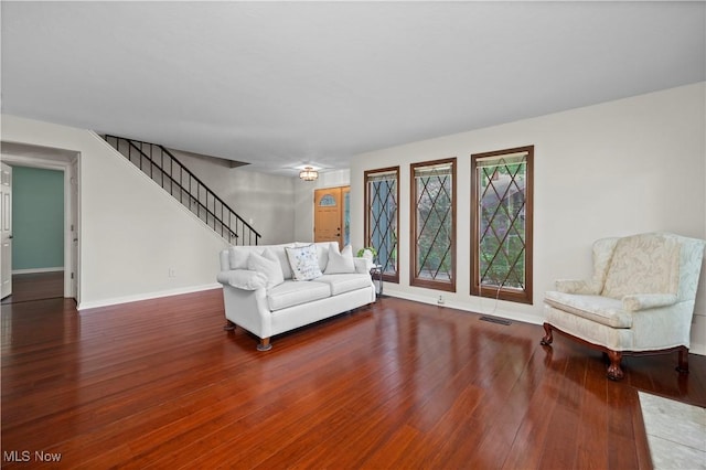5550 Barton Rd, North Olmsted, OH 44070 - living room featuring stairway, wood finished floors, and baseboards