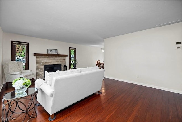 5550 Barton Rd, North Olmsted, OH 44070 - living room featuring healthy amount of natural light, baseboards, and dark wood-type flooring
